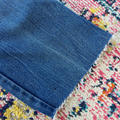 Blue fabric on a multicolored textured surface