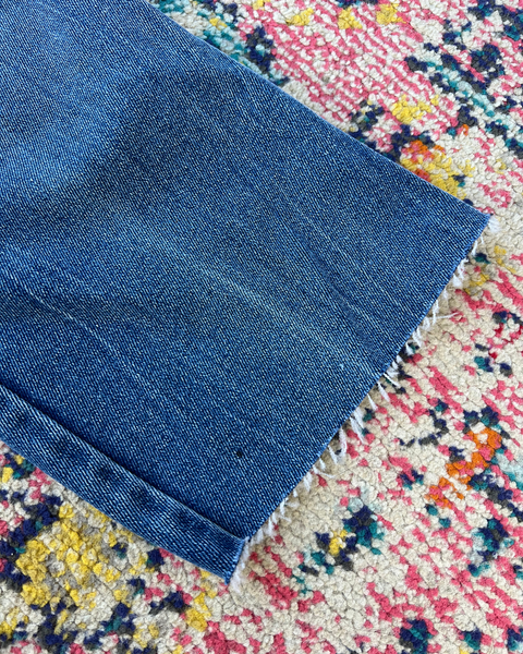 Blue fabric on a multicolored textured surface