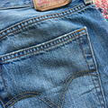 Close-up of Levi's brand label on a pair of blue jeans.