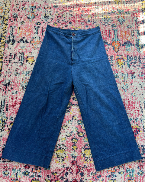 Blue pants on a colorful patterned rug